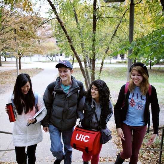 students walking up stairs on campus